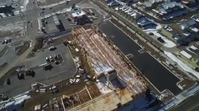 HIDDEN LAKE COLORADO-2016: An Aerial View Of A City With Buildings And Vehicles