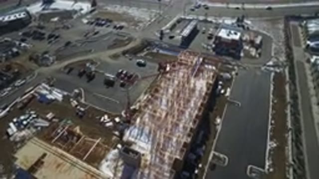 HIDDEN LAKE COLORADO-2016: An Aerial View Of An Industrial Pole With Some Buildings And Cars