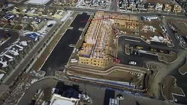HIDDEN LAKE COLORADO-2016: Drone Flying Over Slowly Across A Big City With Car