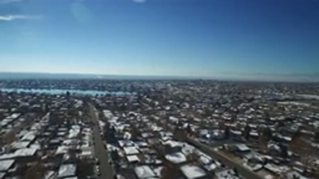 HIDDEN LAKE COLORADO-2016: Snow-Covered Plain Overlooking Rooftops Of Houses