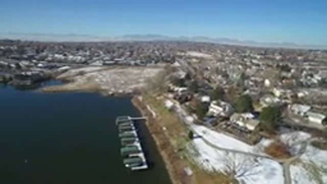 HIDDEN LAKE COLORADO-2016: Snowy Terrain With City Beside the Lake