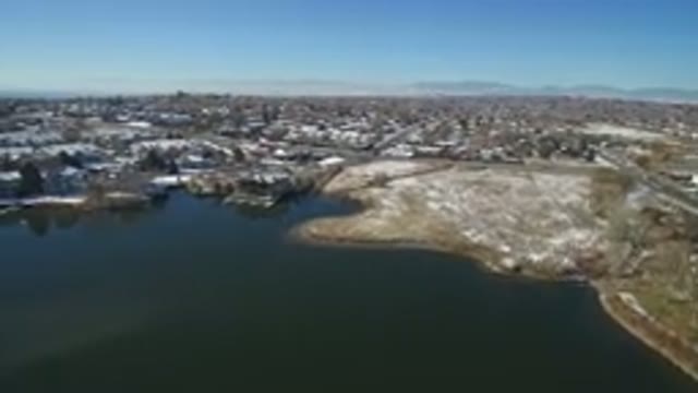 HIDDEN LAKE COLORADO-2016: Winter Aerial View Of A Lake And Town