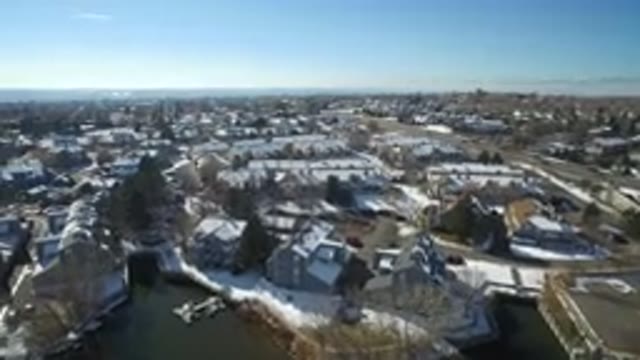 HIDDEN LAKE COLORADO-2016: Aerial Filming Of A Lakeside Town With Houses And A Pier
