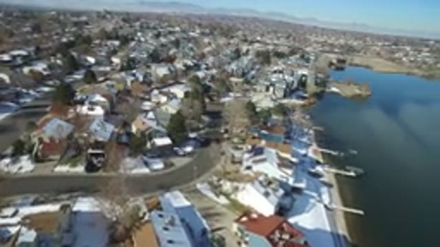 HIDDEN LAKE COLORADO-2016: Houses Sit Peacefully Next To A Big Lake With Clear