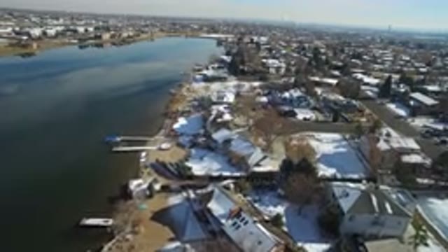 HIDDEN LAKE COLORADO-2016: Top View Of A City With Lots Of Buildings And Water
