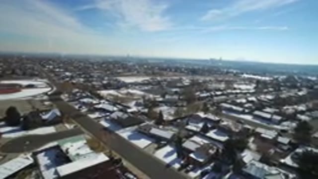 HIDDEN LAKE COLORADO-2016: Snowy Suburbs With A Street View Next To A Small Lake