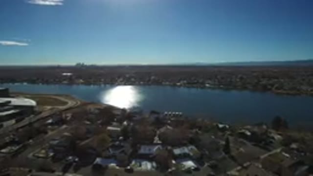 WESTMINSTER COLORADO-2016: Plane Or Helicopter Hovering Over A Town Of Houses