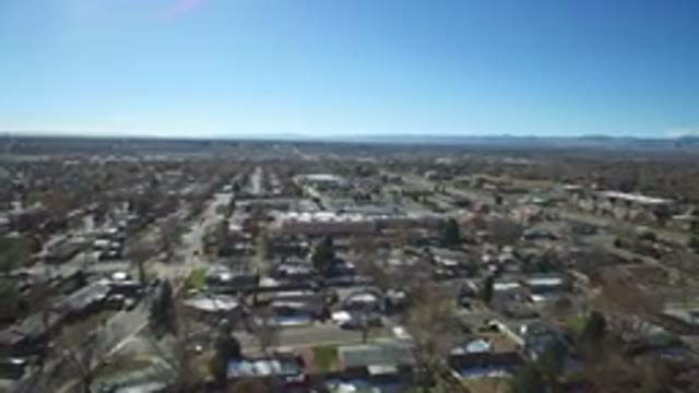 WESTMINSTER COLORADO-2016: Aerial View Of A City With Buildings And Water Around