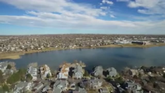 WESTMINSTER COLORADO-2016: Landscape Ocean And Houses Flying Over A Town By The