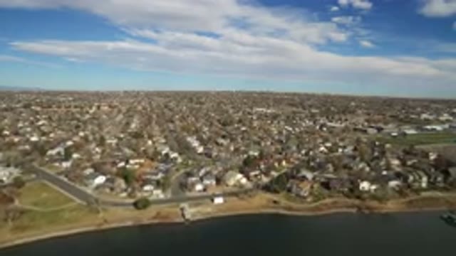 WESTMINSTER COLORADO-2016: Suburban Development Sits On Body Of Water And Stretches Along Horizon