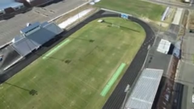 WESTMINSTER COLORADO-2016: Running Athlete on Court with Spotlights, Grass, Grandstand, and Bird View