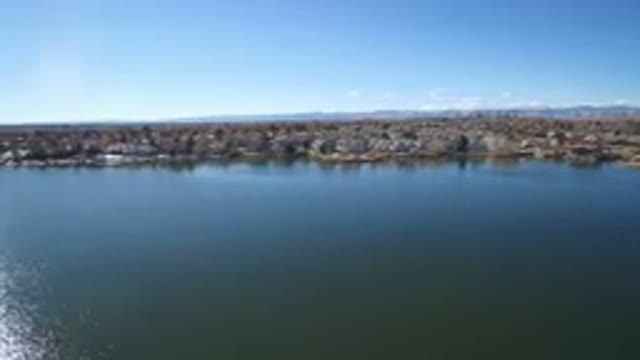 WESTMINSTER COLORADO-2016: Over A Lake Shooting Video Of A Small Town With