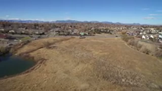 WESTMINSTER COLORADO-2016: A Muddy Lake Seen Near the Highway