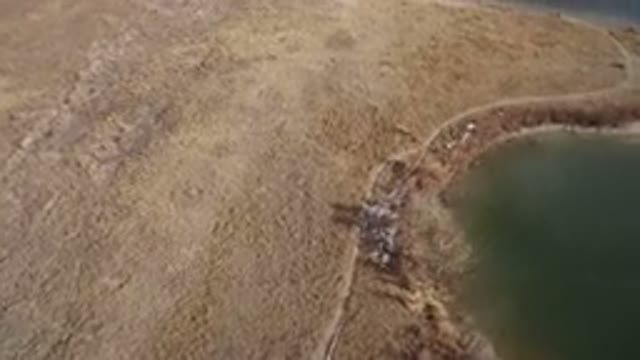 WESTMINSTER COLORADO-2016: Rotating Aerial View Of Brown Grassy Peninsula In
