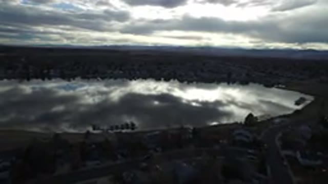 WESTMINSTER COLORADO-2016: Small Lake Surrounded By Houses Trees And Roads