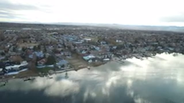 WESTMINSTER COLORADO-2016: Plane Flying Across Lake Or River With City On The