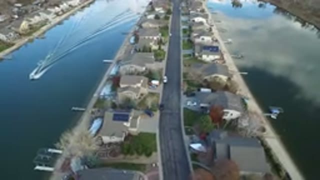 WESTMINSTER COLORADO-2016: Houses In The Middle Of Two Arms Of A Lake With Calm