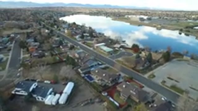 WESTMINSTER COLORADO-2016: Aerial View Of A Lake Of Sparkling Water Near A Road