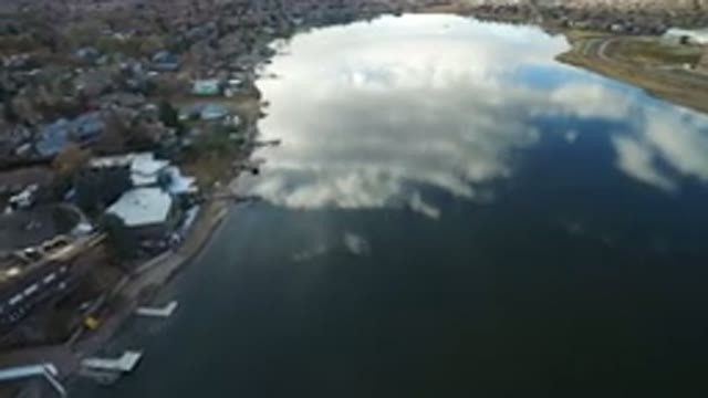WESTMINSTER COLORADO-2016: Showing A Lake With A Neighborhood Nearby