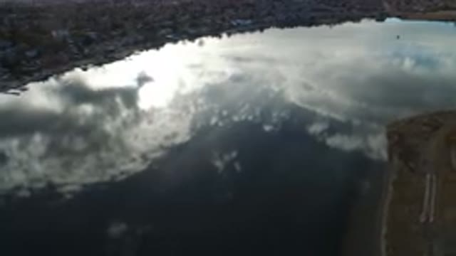 WESTMINSTER COLORADO-2016: Lake With A City Around And Water So Calm That Reflects The Sky