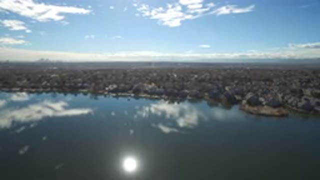 WESTMINSTER COLORADO-2016: The Reflection of the Sun and Clouds on the Lake