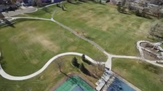 WESTMINSTER COLORADO-2016: Aerial Footage Of A Large Grassy Area With A Tennis Court