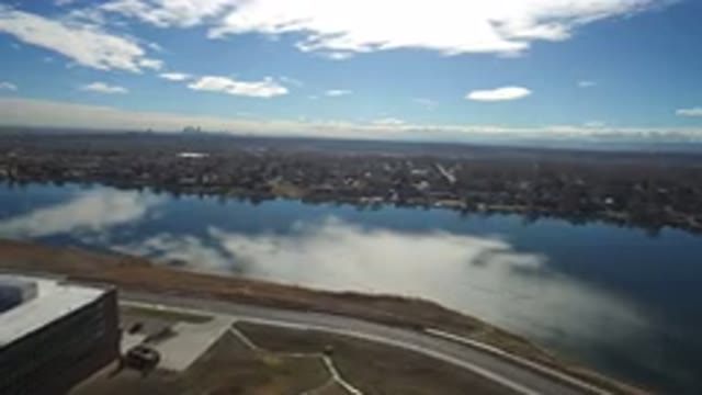 WESTMINSTER COLORADO-2016: Drone Footage Of A Large River Where The Clouds Reflect