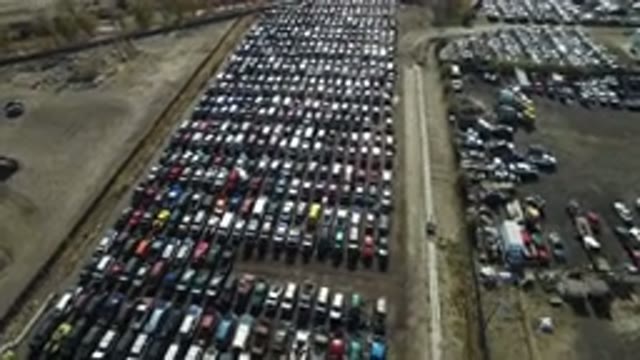 WESTMINSTER COLORADO-2016: Large Lot Of Parked Vehicles With Railroad Tracks In Background