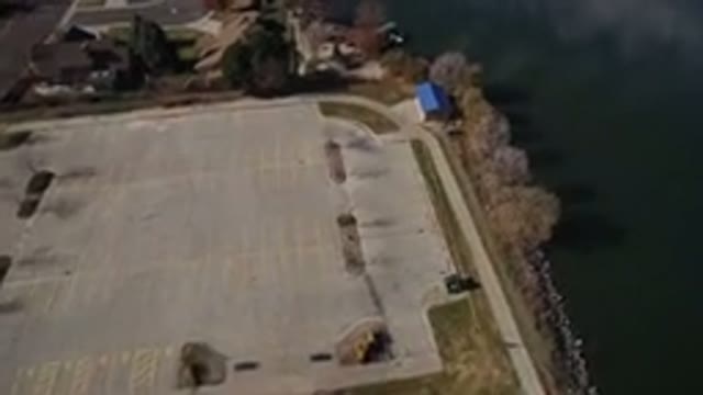 WESTMINSTER COLORADO-2016: Aerial View Of Still Green Grey Water With Houses And Docks