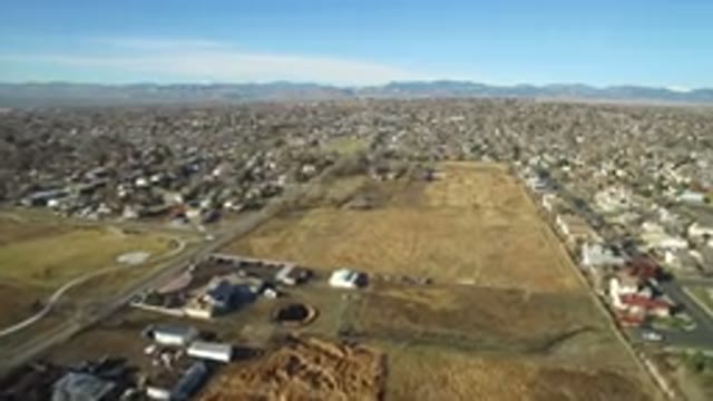 WESTMINSTER COLORADO-2016: Plane Flying Above A Grassy Field With A Child In Red