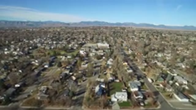 WESTMINSTER COLORADO-2016: Establishing Shot Of Large Desert Suburb With Mountains