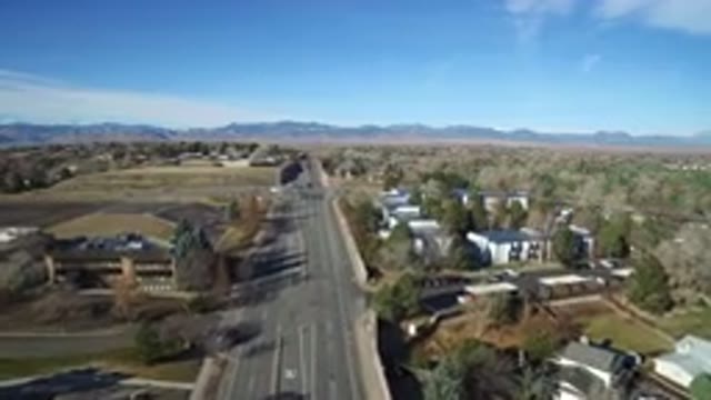 WESTMINSTER COLORADO-2016: Aerial View Of A City With Little Traffic And Mountains