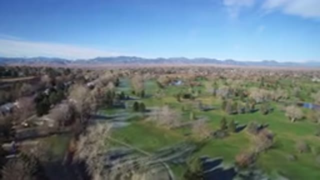 WESTMINSTER COLORADO-2016: Emerald Green Field With Huge Mountains In Background