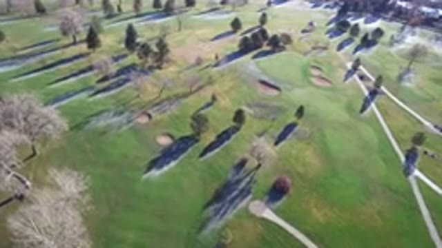WESTMINSTER COLORADO-2016: Drone Flying Over Golf Course With Bunkers And Greens