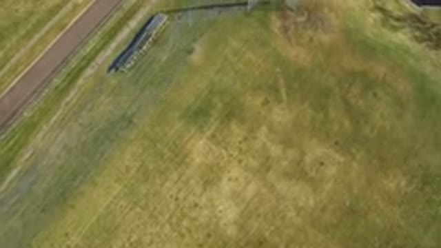 WESTMINSTER COLORADO-2016: Bird's Eye View Panning Over A Field Of Grass And A