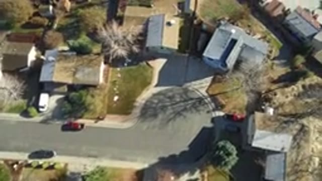 WESTMINSTER COLORADO-2016: Plane Flying Above Small Town With Houses And Land And