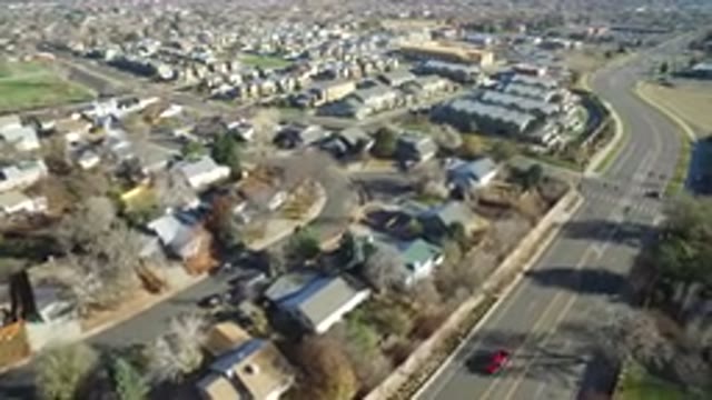 WESTMINSTER COLORADO-2016: Drone View of Suburban Area on a Sunny Day with Highway and Cars