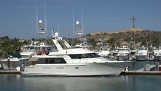 SAN JOSE DEL CABO MEXICO-2017: White Yacht at Calm Pier with People