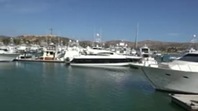 SAN JOSE DEL CABO MEXICO-2017: Boats Moored Nearby With Mountains In The Background