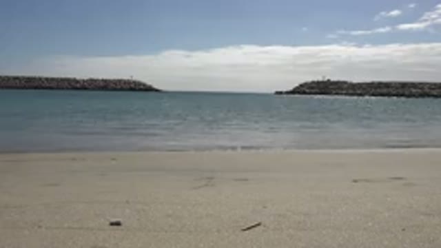 SAN JOSE DEL CABO MEXICO-2017: Beach With Sea Waves Hitting The Sand Blue Sky