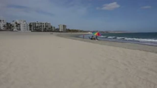 SAN JOSE DEL CABO MEXICO-2017: Wide White Sand Beach With Dark Sea And Breaking Waves