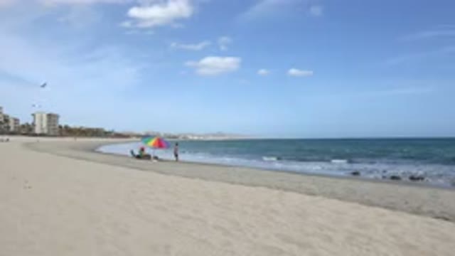 SAN JOSE DEL CABO MEXICO-2017: Empty Beach With One Umbrella and Two People