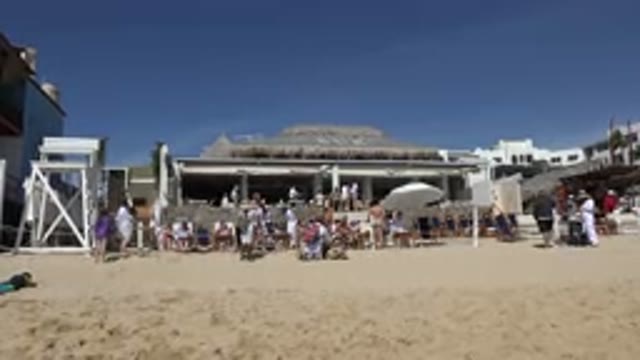 CABO SAN LUCAS MEXICO-2017: Many People Are Outside On The Beach With Numerals
