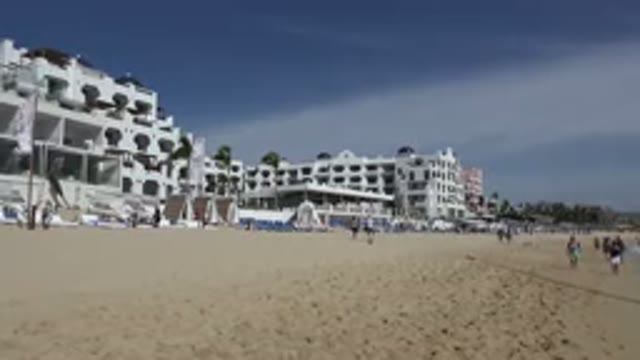 CABO SAN LUCAS MEXICO-2017: Beach With Lots Of People Enjoying A Sunny Day On