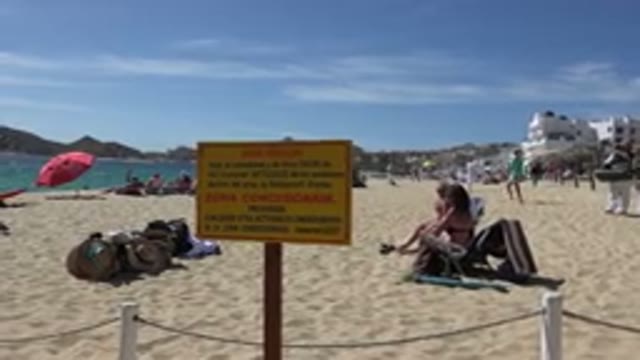 CABO SAN LUCAS MEXICO-2017: Seaside Beach With People Enjoying The Sun With Umbrellas