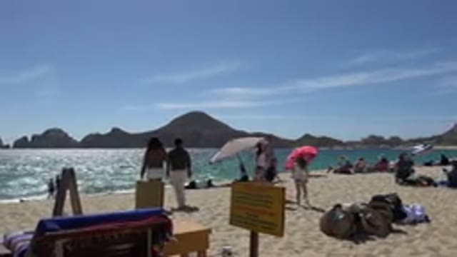 CABO SAN LUCAS MEXICO-2017: People Enjoying A Beach On A Sunny Day With White Sand