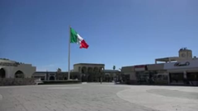 LOS CABOS MEXICO-2017: The Flag Flying High On The Pole In Front Of The