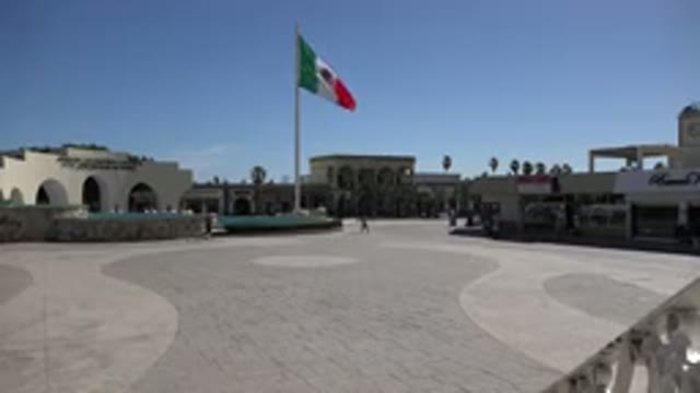 LOS CABOS MEXICO-2017: People Walking Through A Quiet Mexican Town Square