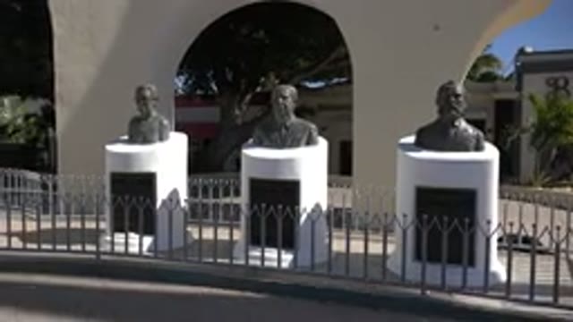 LOS CABOS MEXICO-2017: Calm Viewing Of Statue Busts In Outside Plaza On Sunny Day