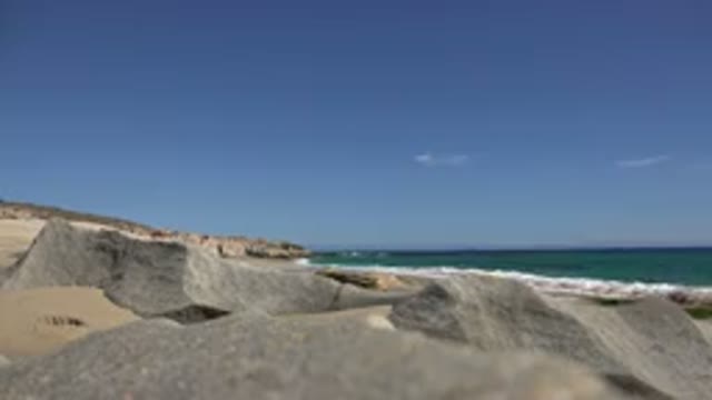 LOS CABOS MEXICO-2017: Beautiful Ocean Waves In Front Of The Sands And Rocks On